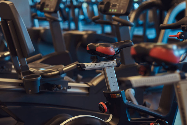 Interior of fitness hall with fitness bicycles. - Foto, imagen