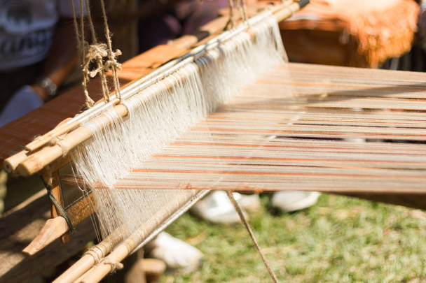 Household Loom weaving - Detail of weaving loom for homemade silk or textile production of Thailand  - Photo, Image