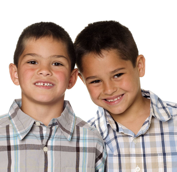 Two young boys, studio photo, isolated against white background, Friendship, brotherhood and health care concept - Фото, зображення