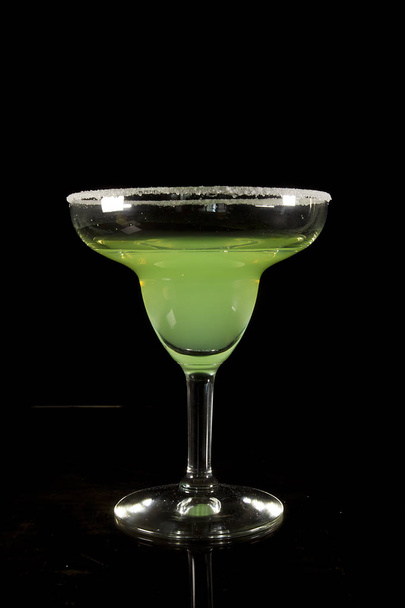 Classic Margarita Cocktail on a Black Reflective Surface - Fotó, kép