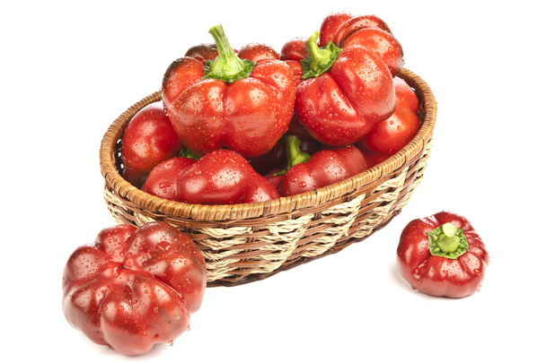 Red pepper in basket on white background - Foto, Imagen