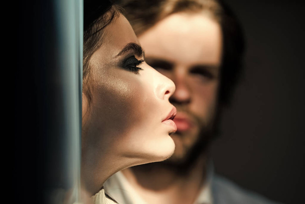 Prelude - couple in love. Woman face profile with blurred man on background - Фото, изображение