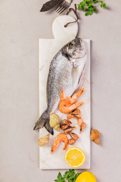Seafood on grey concrete background - Foto, afbeelding