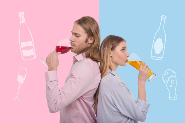 Thoughtful couple drinking alcohol while standing back to back - Foto, Bild