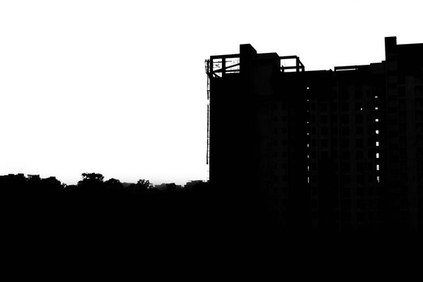 Silhouette of construction site at sunset - Photo, Image