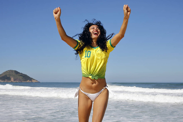 Woman celebrating goal in soccer Brazil - Foto, Bild