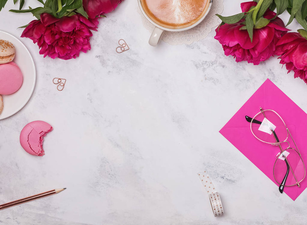 Coffee, pink peonies and beautiful feminine accessories on the marble background - Foto, Imagem