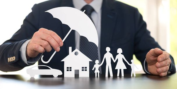 General agent protecting a family, a house and a car with his hands - Photo, image
