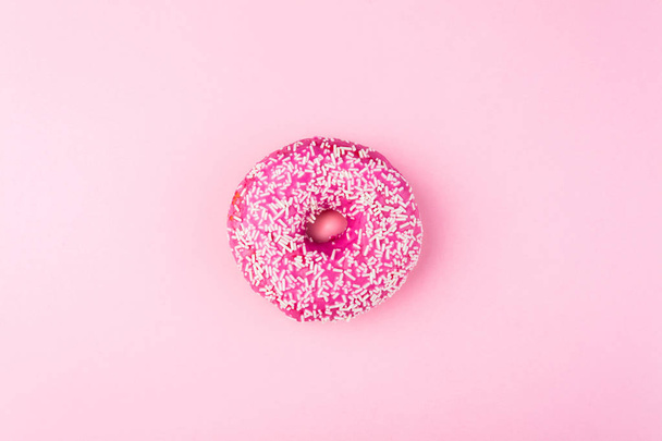Pink glazed donut on pink pastel background - Foto, Imagem