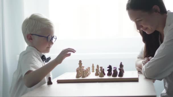 woman and boy playing chess - Footage, Video