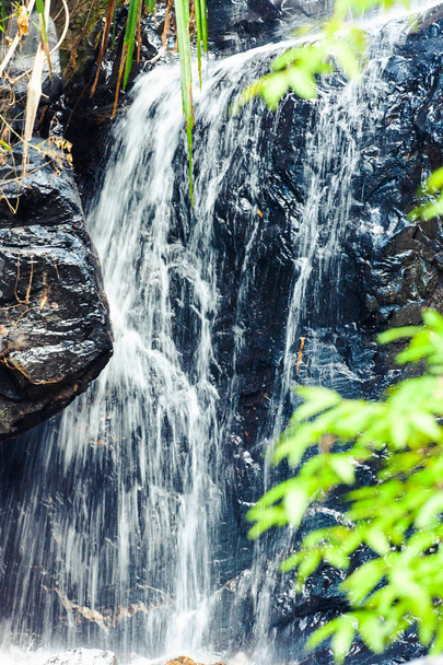 Tropical waterfall on mountain river in jungle. Langkawi, Malaysia. - Foto, immagini