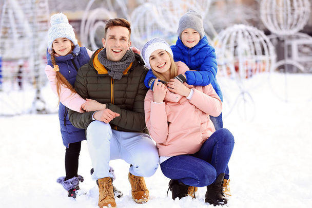 Portrait of happy family outdoors on winter day - Foto, Imagen
