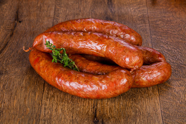 Pork sausages over wooden background - Photo, Image