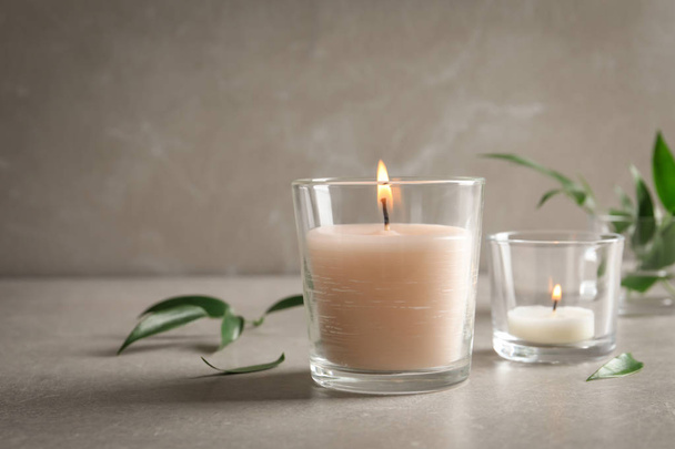 Burning wax candles in glasses on table - Photo, Image