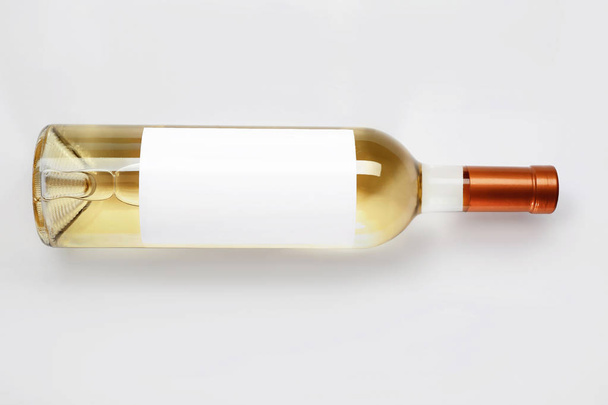 Bottle of delicious wine with blank label on white background - Zdjęcie, obraz