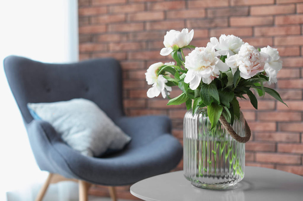 Vase with beautiful flowers on table indoors. Interior decor element - Foto, Imagem