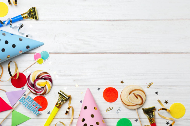 Flat lay composition with birthday party items on wooden background - Fotografie, Obrázek