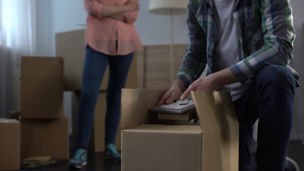 Wife nervously waiting while her unfaithful spouse taking things and moving out - Footage, Video