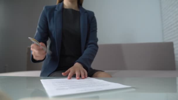 Woman signing documents to receive money, taking loan in bank, startup business - Footage, Video