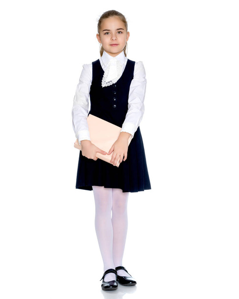 Hermosa niña en uniforme escolar
. - Foto, Imagen