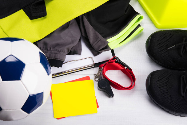 Sportswear, soccer ball and objects for the judge, on a gray background - Fotoğraf, Görsel