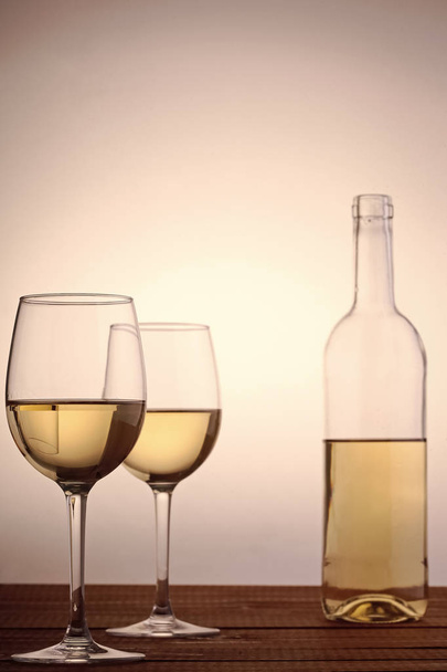 Bottle and glasses with white wine - Zdjęcie, obraz