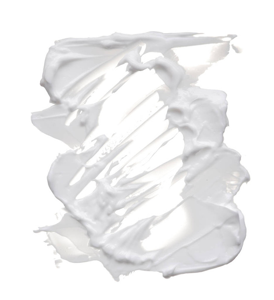 White ?reamy texture isolated on white background. Smear of face cream on white background - Photo, image