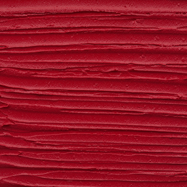 Red matte texture of lip gloss background. Red creamy lipstick texture background - Fotó, kép