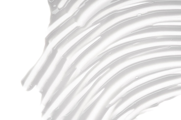 Gently pink creamy texture isolated on white background. Smear of face cream on white background - Zdjęcie, obraz