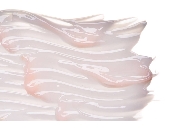 Gently pink creamy texture isolated on white background. Smear of face cream on white background - Φωτογραφία, εικόνα