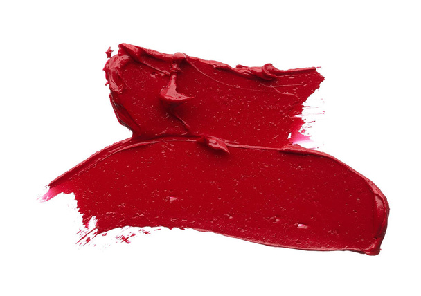Red makeup smear of matte lip gloss isolated on white background. Red creamy lipstick texture isolated on white background - Φωτογραφία, εικόνα