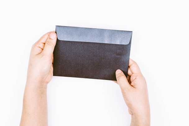 Hand hold envelope on white background - Foto, Imagen