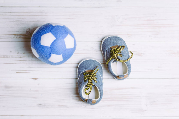 Baby shoes on wooden background - Photo, Image