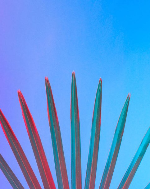 Tropical leaf in vibrant bold gradient holographic neon colors, Concept art, Minimal surrealism background  - Фото, зображення