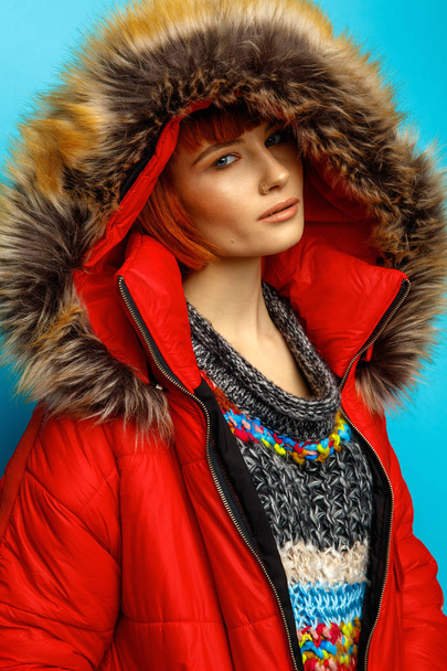 Portrait of beautiful woman with red hair wearing winter jacket  - Fotoğraf, Görsel