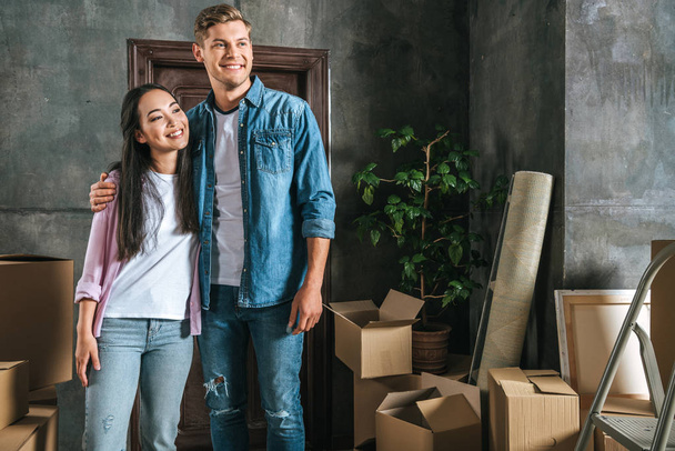 thoughtful happy young couple moving into new home - Fotografie, Obrázek