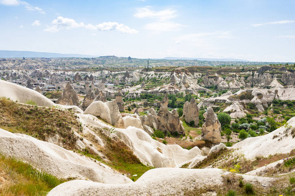 Travel to Turkey - view of mountain valley with Goreme town in Cappadocia in spring - Fotografie, Obrázek