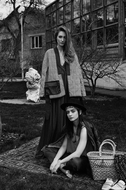 Two young female fashion models posing outdoors                - Zdjęcie, obraz