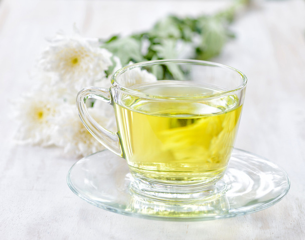 Cup of herbal tea and flowers - Foto, Imagen