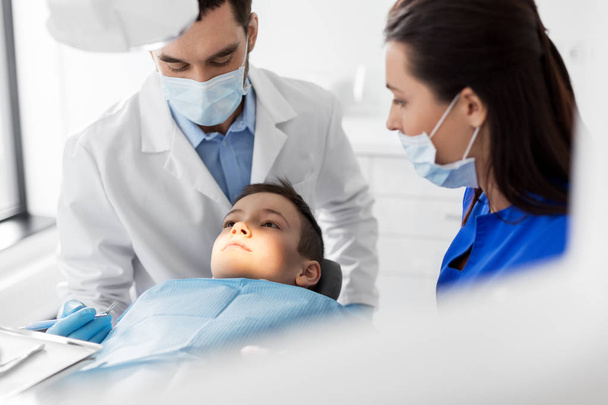 dentist checking for kid teeth at dental clinic - Photo, Image