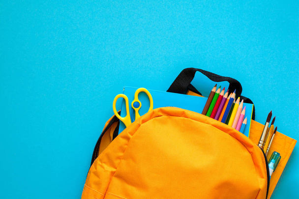 Back to school concept. Backpack with school supplies. Top view. Copy space - Photo, Image