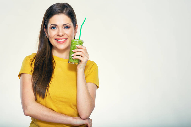 Smiling woman with long hair holding glass with green smoothie isolated on white background - Foto, immagini