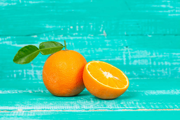 orange fruit on color table background. - Foto, Imagen
