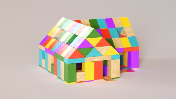 Colorida casa hecha de bloques de madera. Cámara sartenes a su alrededor
. - Imágenes, Vídeo