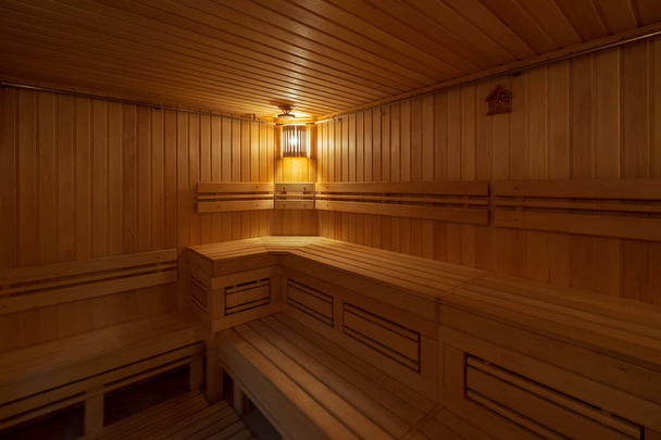 Interior of the public wooden sauna - Fotoğraf, Görsel