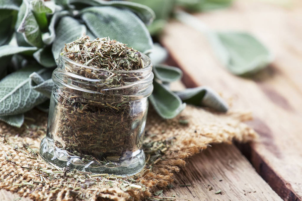 Dried and fresh sage, rustic style, vintage wooden background, selective focus - Фото, зображення