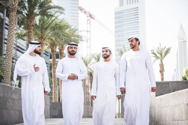 Arabian men meeting and talking about business - Businessmen portrait in Dubai - Foto, Imagen