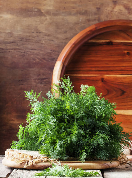 Fresh dill on the old wooden table, rustic style, selective focus - Fotoğraf, Görsel