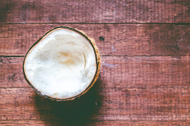 Coconut on a wooden background - 写真・画像