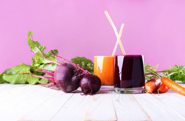 Juices Organic Smoothie Vegetables Beet Carrots Glasses Red Orange Brightly Natural Vitamins Health Concept Pink and White Wooden Background - Photo, Image
